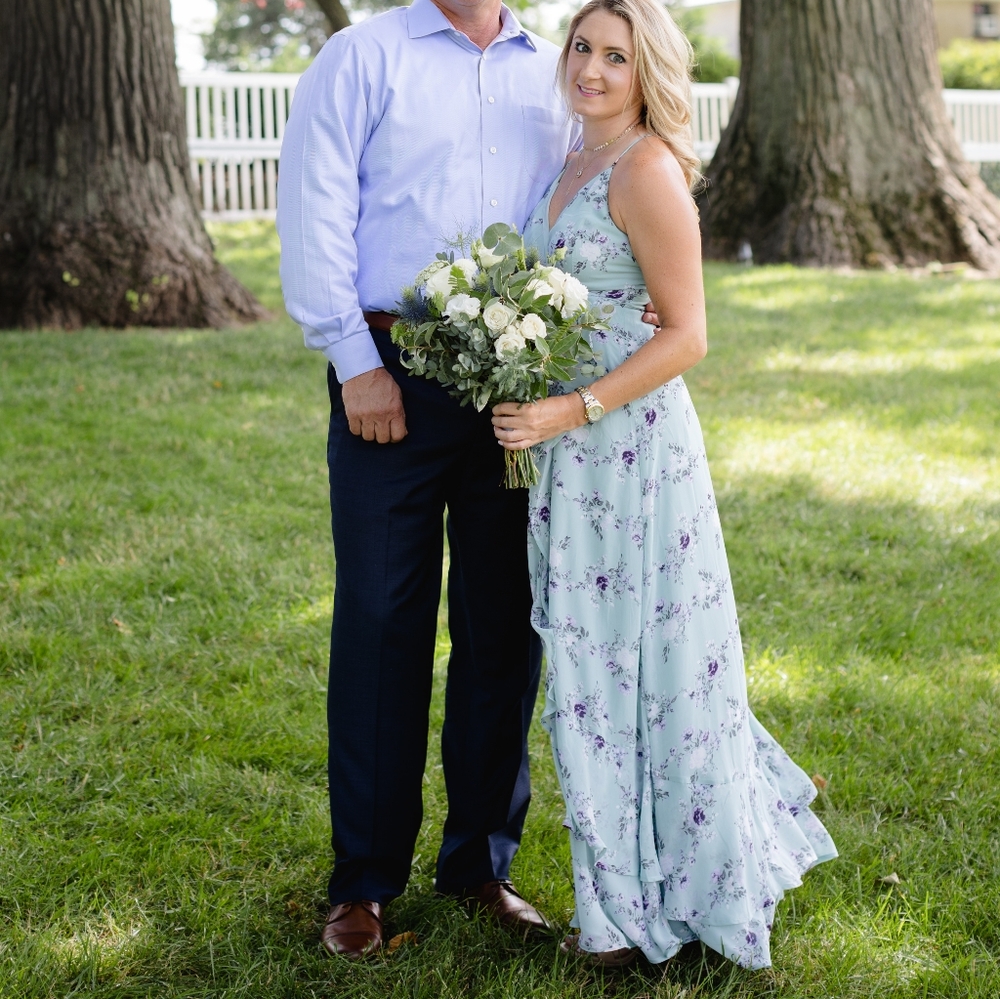 Green flowy dress with flowers.